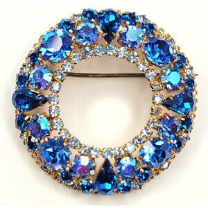 Austria Goldtone Blue Rhinestone Open Round Brooch Signed